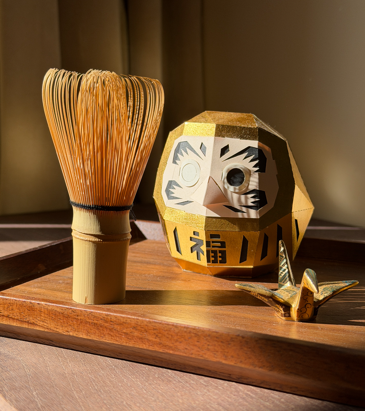A chasen, the bamboo matcha whisk, among the objects in the selection.
